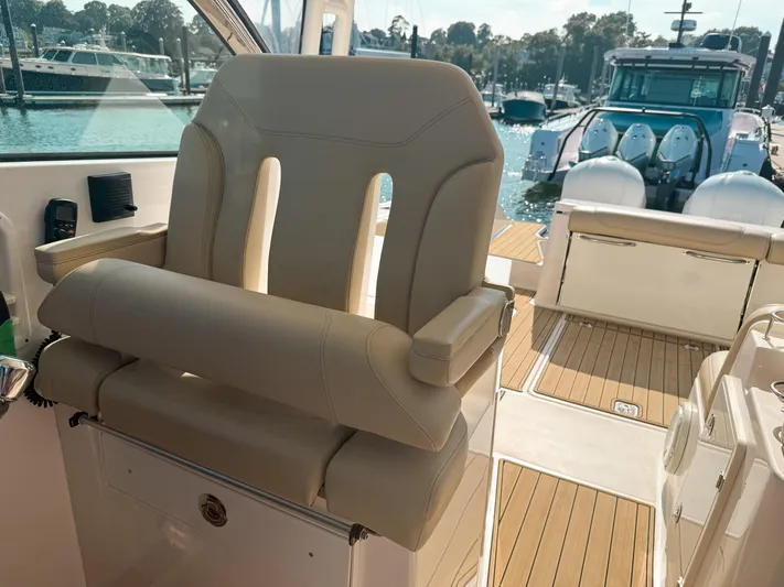 Adios Yacht Photos Pics 2018 Pursuit DC 325 Dual Console boat interior with luxurious seating and teak flooring.