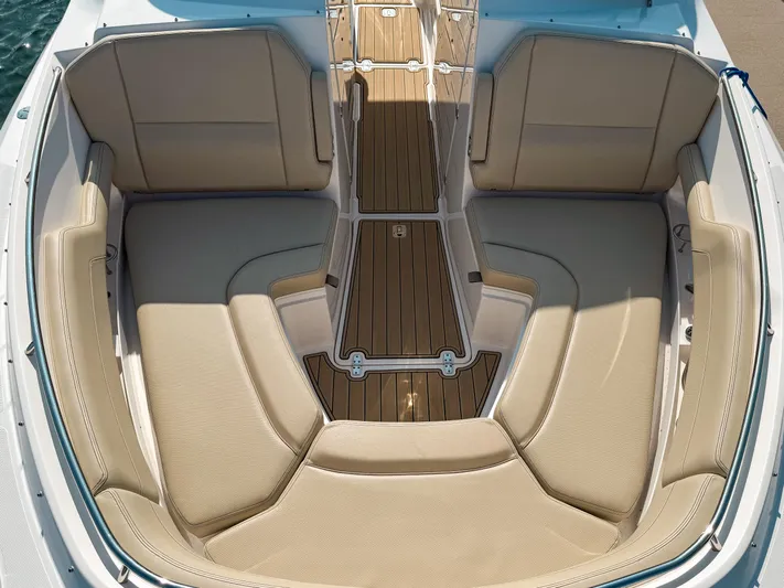 Adios Yacht Photos Pics 2018 Pursuit DC 325 Dual Console boat with spacious beige seating and teak flooring.