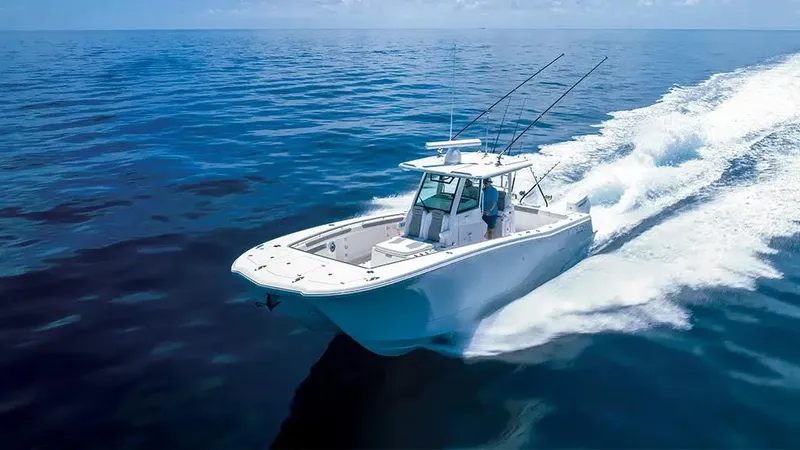  Yacht Photos Pics 2025 Caymas 34 CT boat cruising on open ocean waters.