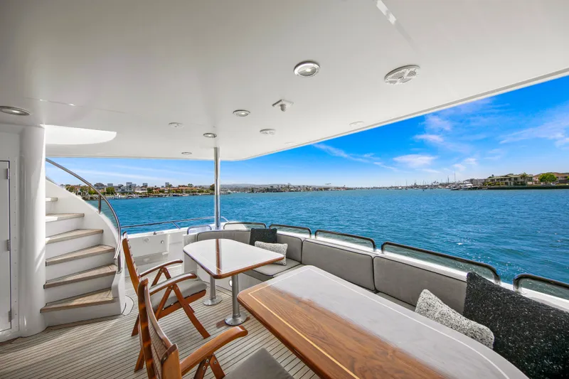 Fansea Yacht Photos Pics Luxurious 1998 Westport Sovereign yacht deck with seating, overlooking serene blue waters.