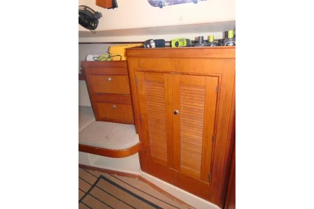 Wild Blue Yacht Photos Pics Interior of 1999 Island Packet 45 sailboat with wooden cabinetry and storage.