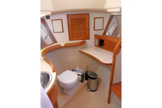 Wild Blue Yacht Photos Pics 1999 Island Packet 45 yacht bathroom with wooden accents and modern amenities.