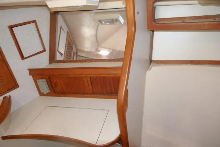 Wild Blue Yacht Photos Pics Interior of 1999 Island Packet 45 yacht with wooden accents and mirror.