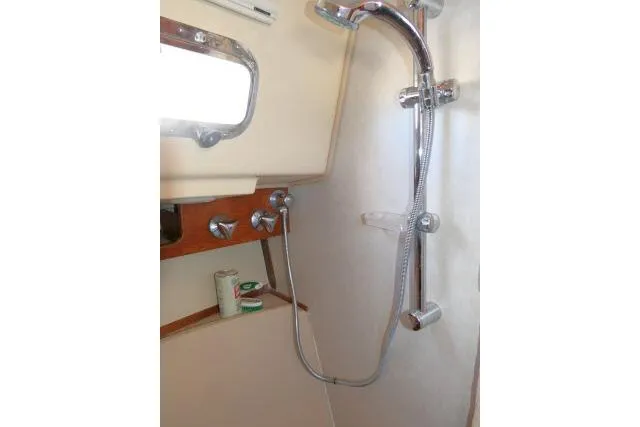 Wild Blue Yacht Photos Pics Shower area in 1999 Island Packet 45 sailboat with chrome fixtures.