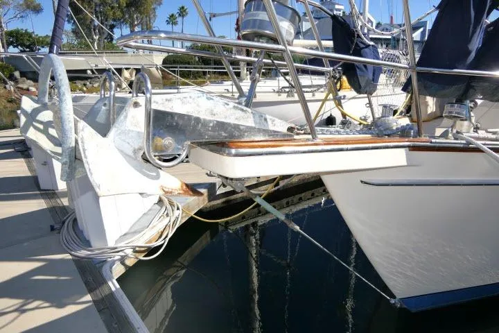 Wild Blue Yacht Photos Pics 1999 Island Packet 45 sailboat docked, showcasing bow and deck details.
