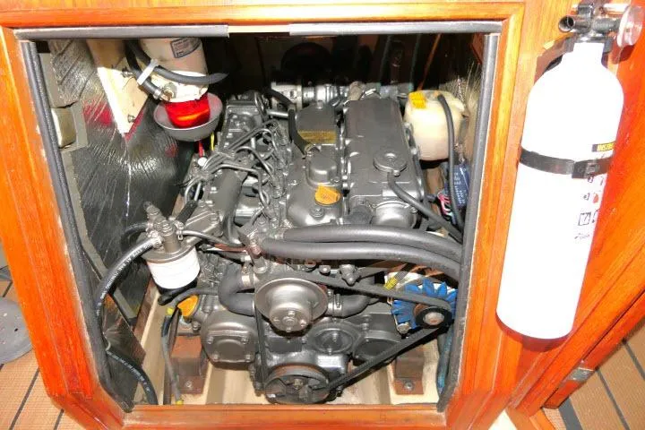 Wild Blue Yacht Photos Pics Engine compartment of a 1999 Island Packet 45 sailboat, featuring detailed mechanical components.