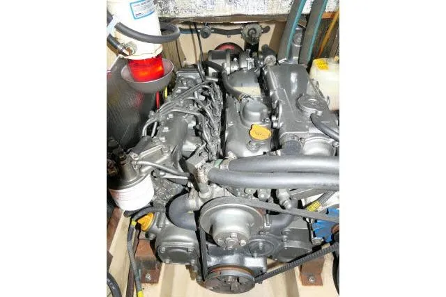 Wild Blue Yacht Photos Pics Engine of a 1999 Island Packet 45 sailboat, showcasing mechanical components and hoses.