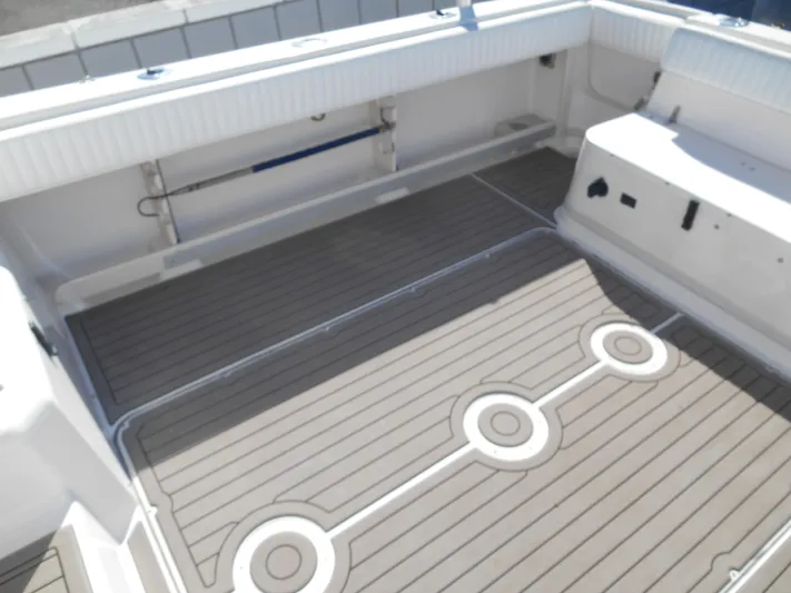 Strike Zone Yacht Photos Pics 2002 Grady-White 282 Sailfish boat deck with modern, clean design and non-slip surface.