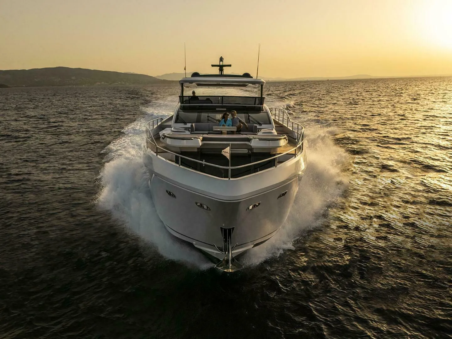 Luxurious Pearl 82 yacht cruising at sunset, 2026 model, on open sea.