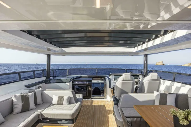 82 Pearl Yacht Photos Pics Luxurious 2026 Pearl 82 yacht interior with modern seating and ocean view.