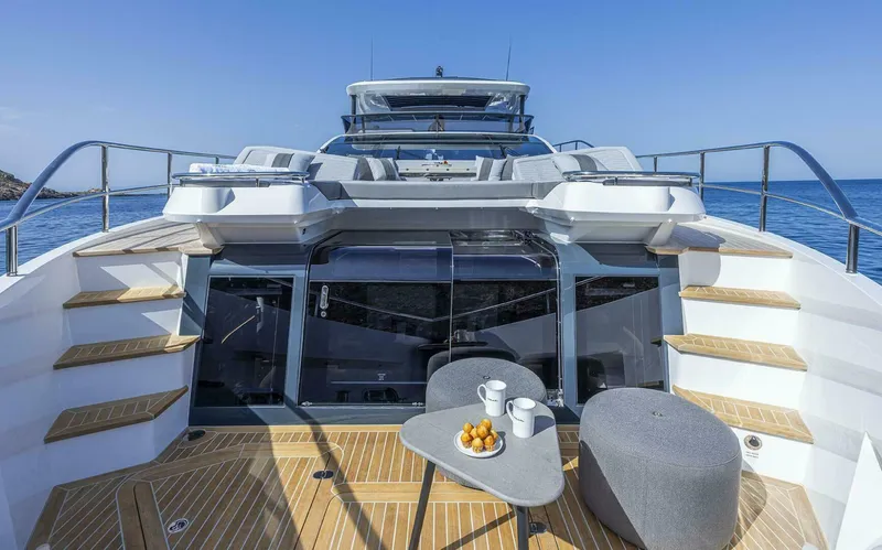 82 Pearl Yacht Photos Pics Luxurious Pearl 82 yacht deck with seating, table, and ocean view, 2026 model.