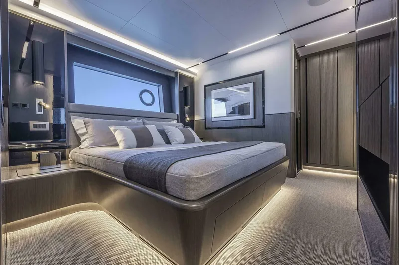 82 Pearl Yacht Photos Pics Luxurious bedroom interior on Pearl 82 yacht, 2026 model, featuring modern design and ambient lighting.