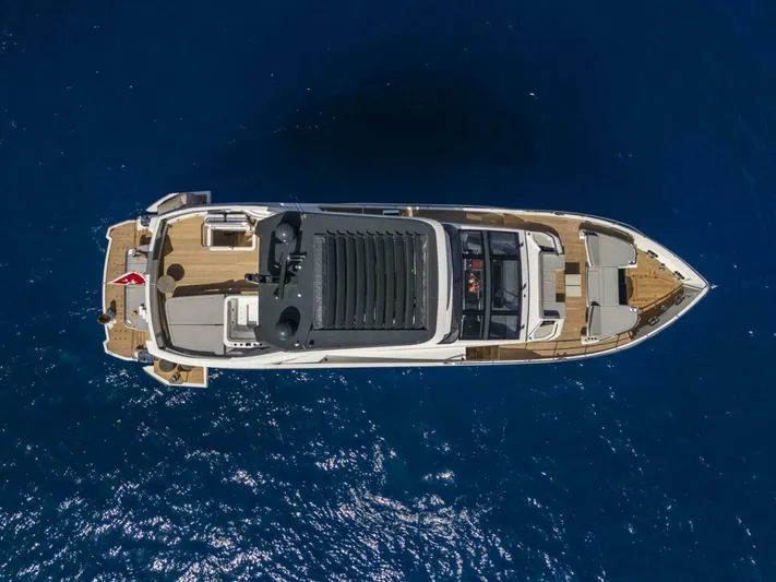 82 Pearl Yacht Photos Pics Aerial view of 2026 Pearl 82 yacht on deep blue ocean water.