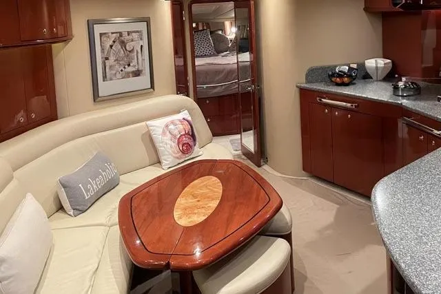 Tigress Yacht Photos Pics Luxurious interior of 2002 Sea Ray 550 Sundancer yacht with elegant seating and modern amenities.