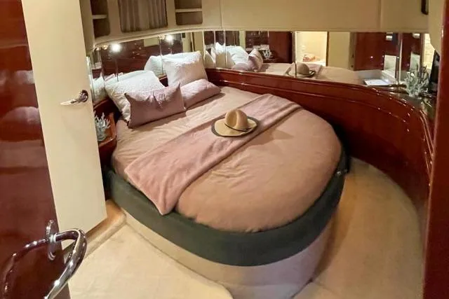 Tigress Yacht Photos Pics Luxurious bedroom interior of 2002 Sea Ray 550 Sundancer yacht with cozy bedding.