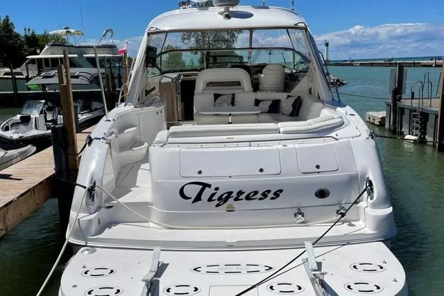 Tigress Yacht Photos Pics 2002 Sea Ray 550 Sundancer yacht docked, featuring spacious seating and sleek design.