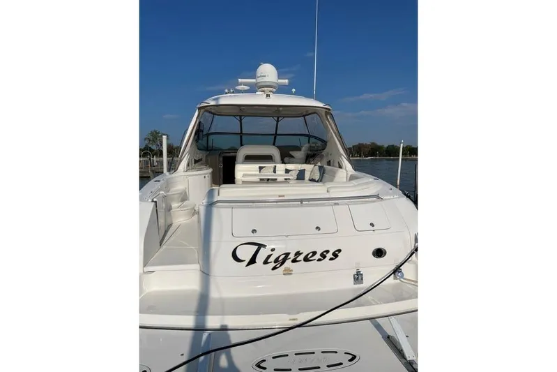 Tigress Yacht Photos Pics 2002 Sea Ray 550 Sundancer yacht named Tigress docked under clear blue sky.