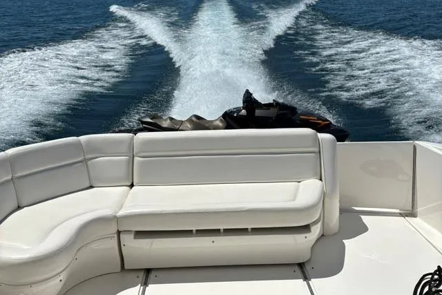 Tigress Yacht Photos Pics 2002 Sea Ray 550 Sundancer yacht with white seating, cruising on open water.