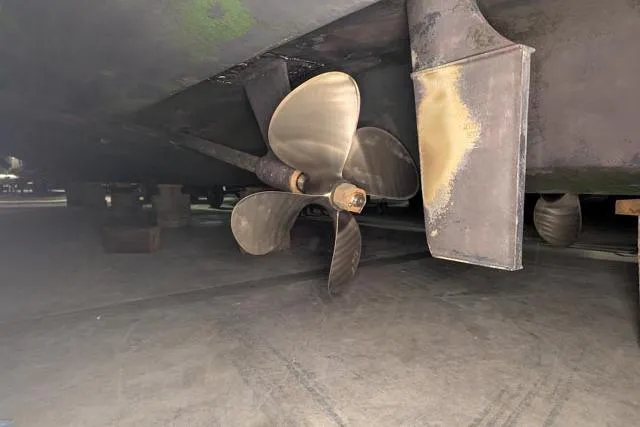 Tigress Yacht Photos Pics Propeller and rudder of 2002 Sea Ray 550 Sundancer yacht in dry dock.