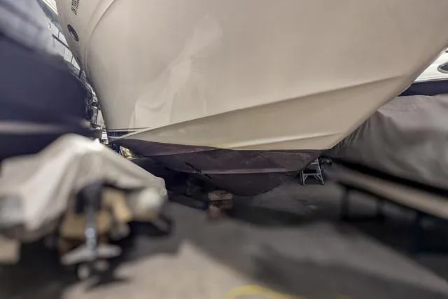 Tigress Yacht Photos Pics 2002 Sea Ray 550 Sundancer boat hull in storage, side view.