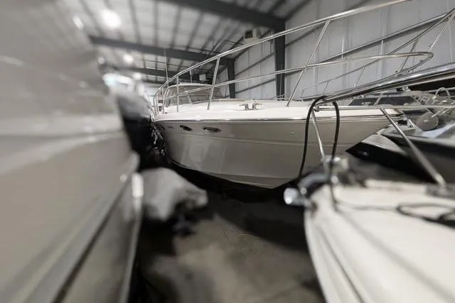 Tigress Yacht Photos Pics 2002 Sea Ray 550 Sundancer yacht in storage, side view, indoor facility.