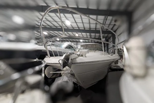 Tigress Yacht Photos Pics 2002 Sea Ray 550 Sundancer yacht in storage, showcasing sleek design and polished metalwork.