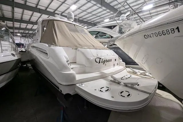 Tigress Yacht Photos Pics 2002 Sea Ray 550 Sundancer yacht in storage, rear view with covered deck.