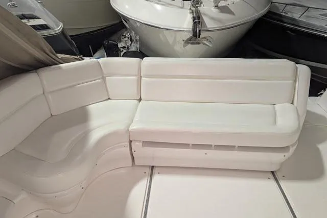 Tigress Yacht Photos Pics 2002 Sea Ray 550 Sundancer interior with white leather seating.