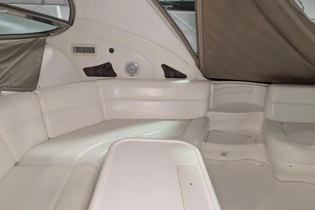 Tigress Yacht Photos Pics Interior of 2002 Sea Ray 550 Sundancer with white leather seating and modern design.