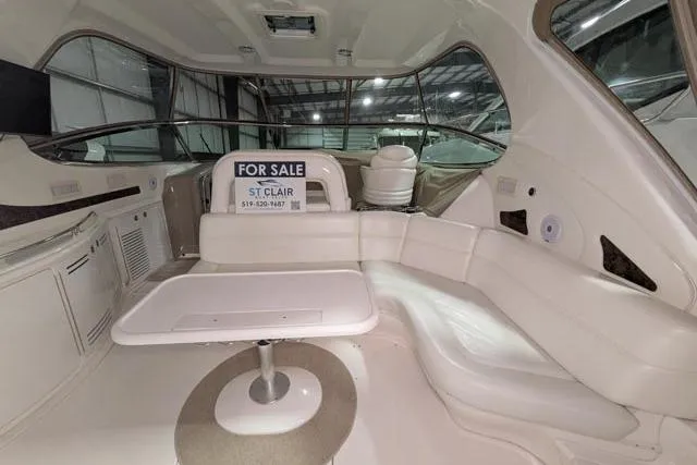 Tigress Yacht Photos Pics Interior of 2002 Sea Ray 550 Sundancer yacht with seating and "For Sale" sign.