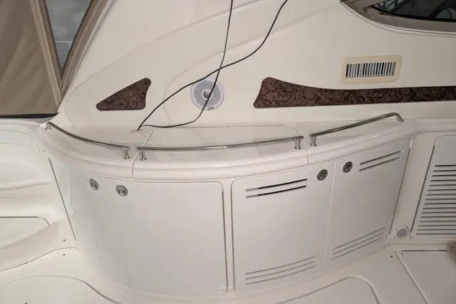 Tigress Yacht Photos Pics 2002 Sea Ray 550 Sundancer interior detail with storage compartments and elegant design.