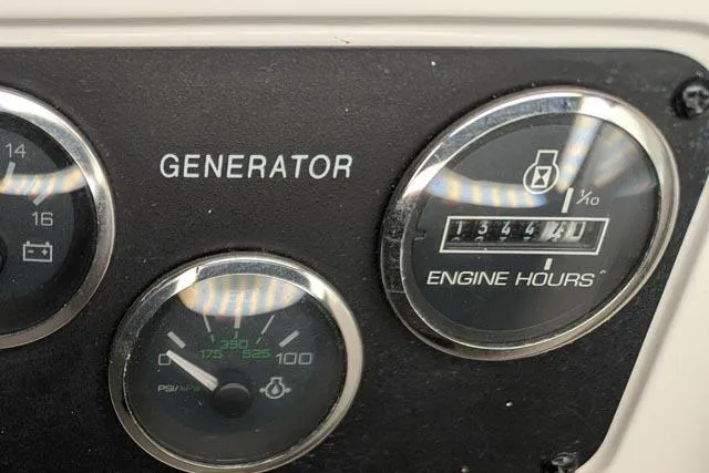 Tigress Yacht Photos Pics Close-up of Sea Ray 550 Sundancer 2002 generator panel showing engine hours.