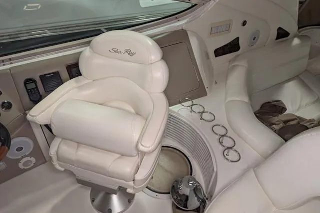 Tigress Yacht Photos Pics Luxurious interior of 2002 Sea Ray 550 Sundancer yacht with plush seating and controls.