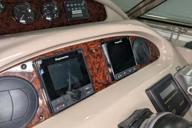 Tigress Yacht Photos Pics Control panel of 2002 Sea Ray 550 Sundancer with Raymarine navigation displays.