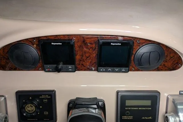 Tigress Yacht Photos Pics Control panel of 2002 Sea Ray 550 Sundancer with Raymarine displays and systems monitor.