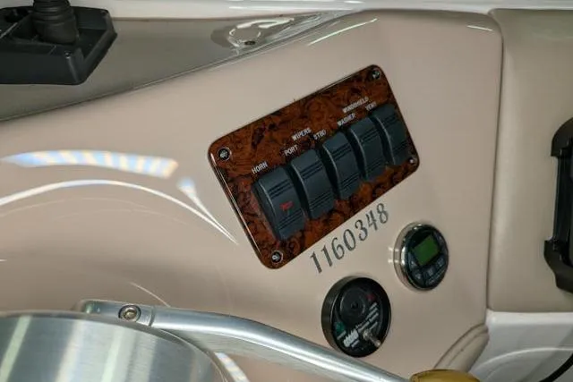 Tigress Yacht Photos Pics Control panel of a 2002 Sea Ray 550 Sundancer boat with switches and gauges.