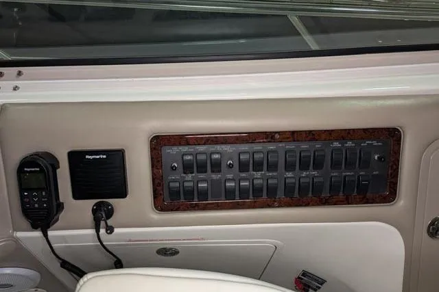 Tigress Yacht Photos Pics Control panel of 2002 Sea Ray 550 Sundancer yacht with switches and Raymarine equipment.
