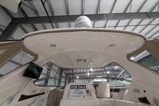Tigress Yacht Photos Pics 2002 Sea Ray 550 Sundancer yacht interior with "For Sale" sign in a marina.