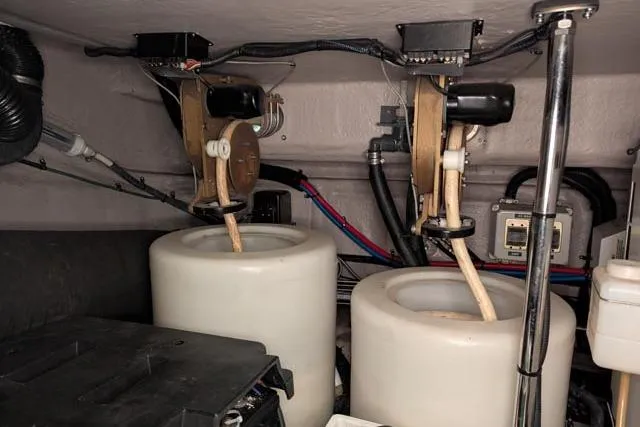 Tigress Yacht Photos Pics Engine room of a 2002 Sea Ray 550 Sundancer with dual tanks and mechanical components.