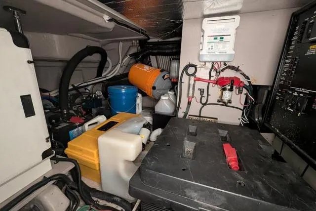 Tigress Yacht Photos Pics Engine room of 2002 Sea Ray 550 Sundancer with equipment and wiring.