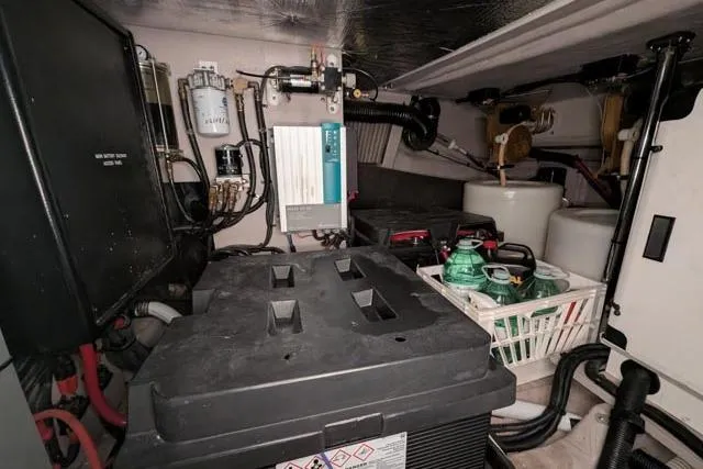 Tigress Yacht Photos Pics Engine room of 2002 Sea Ray 550 Sundancer with equipment and storage.