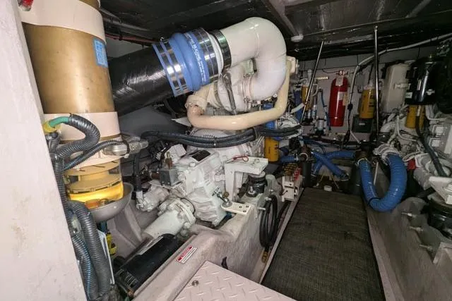 Tigress Yacht Photos Pics Engine room of 2002 Sea Ray 550 Sundancer yacht, showcasing mechanical components and systems.