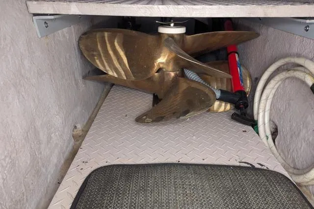 Tigress Yacht Photos Pics Storage compartment of a 2002 Sea Ray 550 Sundancer with propeller and hoses.