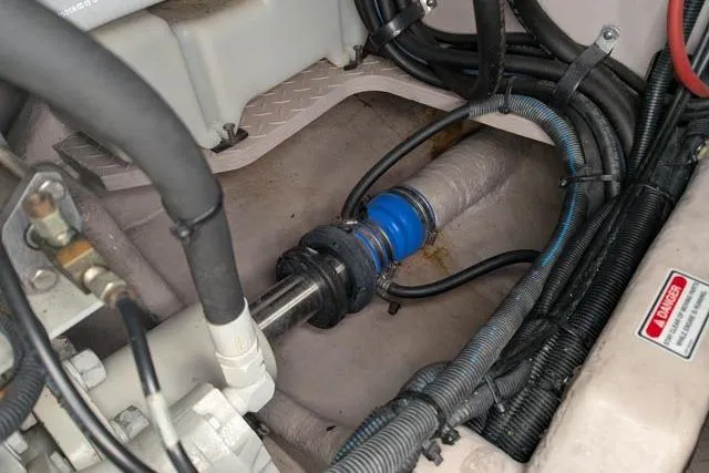 Tigress Yacht Photos Pics Engine compartment of 2002 Sea Ray 550 Sundancer with visible shaft and wiring.