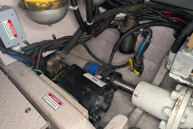 Tigress Yacht Photos Pics Engine compartment of a 2002 Sea Ray 550 Sundancer with visible wiring and components.