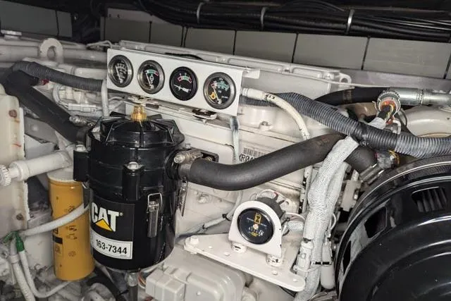 Tigress Yacht Photos Pics Engine compartment of a 2002 Sea Ray 550 Sundancer with CAT components and gauges.