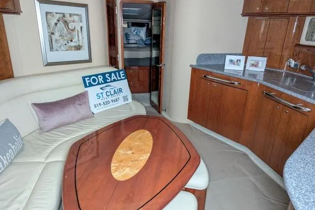 Tigress Yacht Photos Pics Interior of 2002 Sea Ray 550 Sundancer yacht with kitchen and seating area.