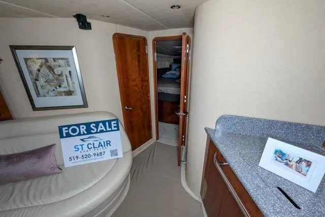 Tigress Yacht Photos Pics Interior of 2002 Sea Ray 550 Sundancer yacht with "For Sale" sign displayed.