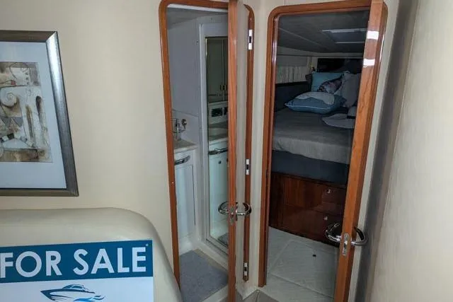 Tigress Yacht Photos Pics 2002 Sea Ray 550 Sundancer interior with bedroom and bathroom, for sale sign visible.