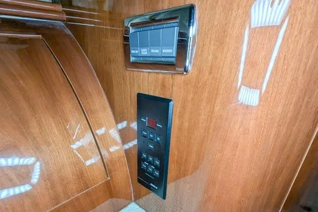 Tigress Yacht Photos Pics Control panel on 2002 Sea Ray 550 Sundancer yacht with wood finish interior.